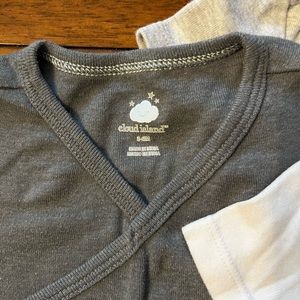 Four cross top onesies in excellent condition. Two pairs of pants.